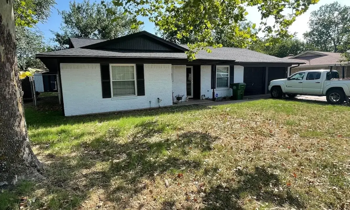 Professional roofing crew working on a residential roof in Glen Burnie